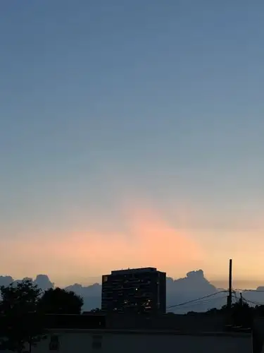 City lights meet a painted sky at dusk.